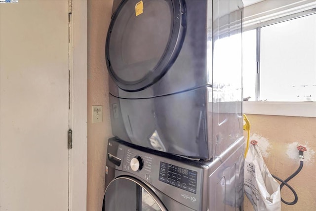 laundry area featuring stacked washer and dryer