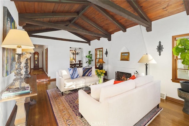 living room featuring vaulted ceiling with beams, dark hardwood / wood-style floors, and wooden ceiling