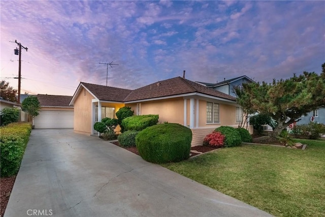 ranch-style home featuring a lawn