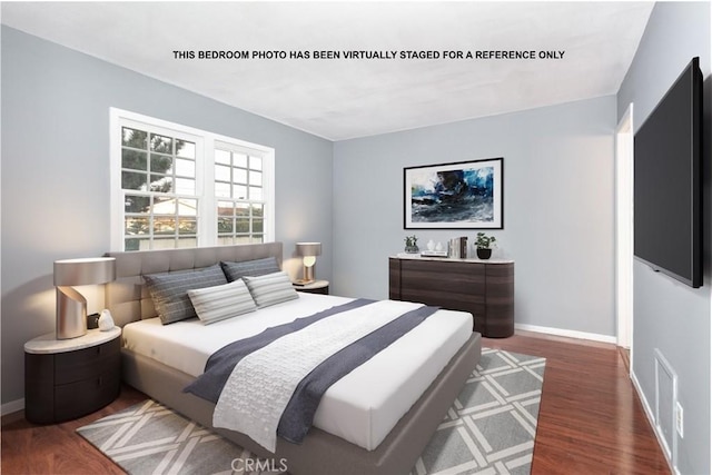 bedroom featuring dark hardwood / wood-style floors