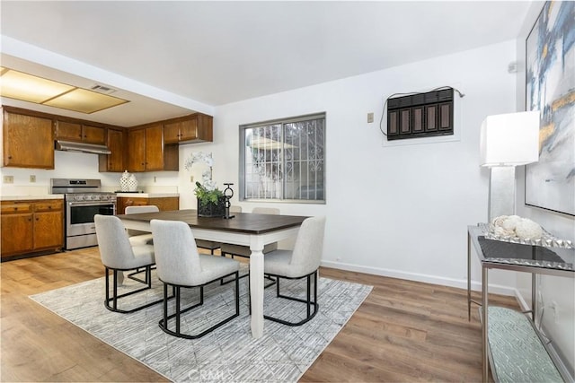 dining area with light hardwood / wood-style flooring