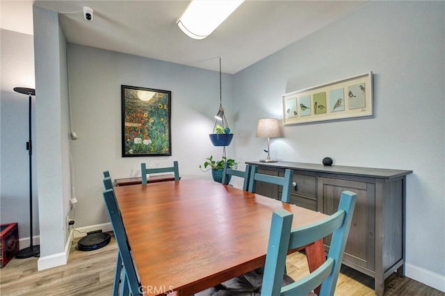 dining area with light hardwood / wood-style floors