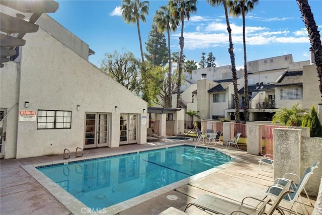 view of pool featuring a patio