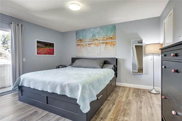 bedroom featuring light wood-type flooring