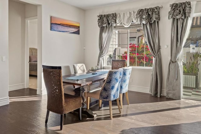 dining space featuring dark hardwood / wood-style floors