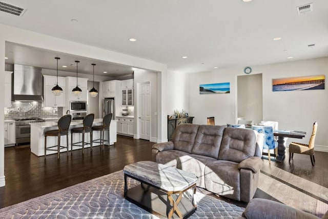 living room featuring dark hardwood / wood-style flooring