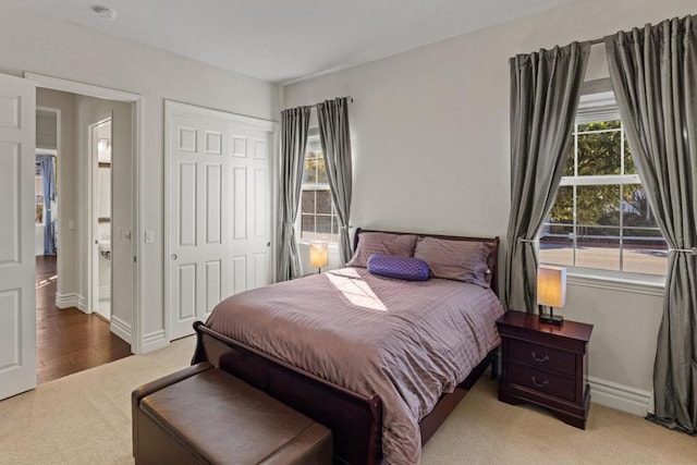 carpeted bedroom with a closet