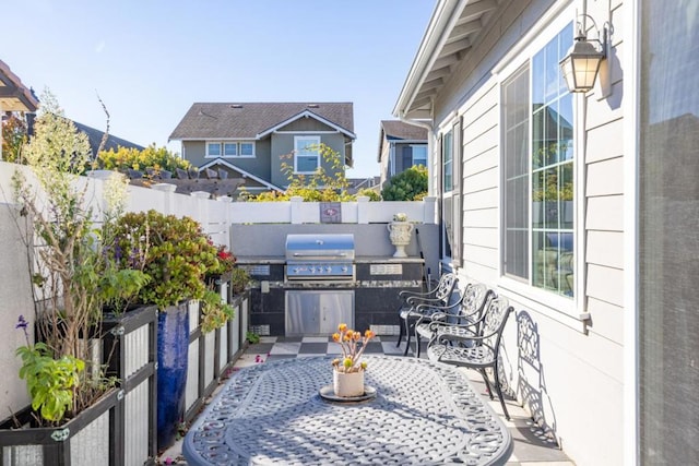 exterior space with exterior kitchen and grilling area