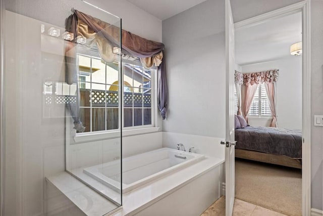 bathroom featuring tile patterned floors and a bathing tub