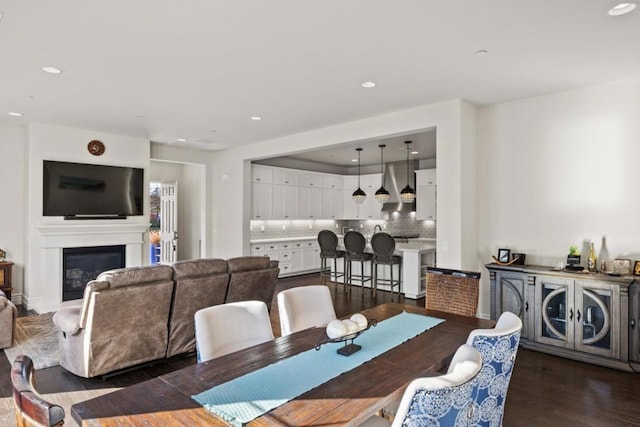 dining space featuring dark hardwood / wood-style floors