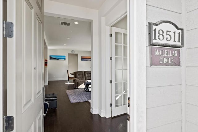 hallway featuring dark wood-type flooring