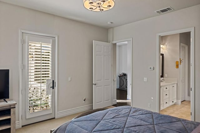 bedroom with light carpet, ensuite bathroom, a chandelier, and sink