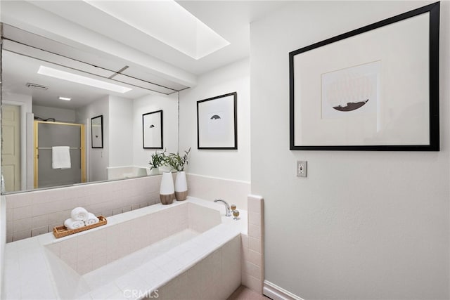 bathroom with a relaxing tiled tub