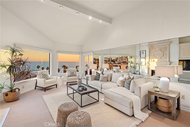 living room with light carpet, high vaulted ceiling, beamed ceiling, and a water view