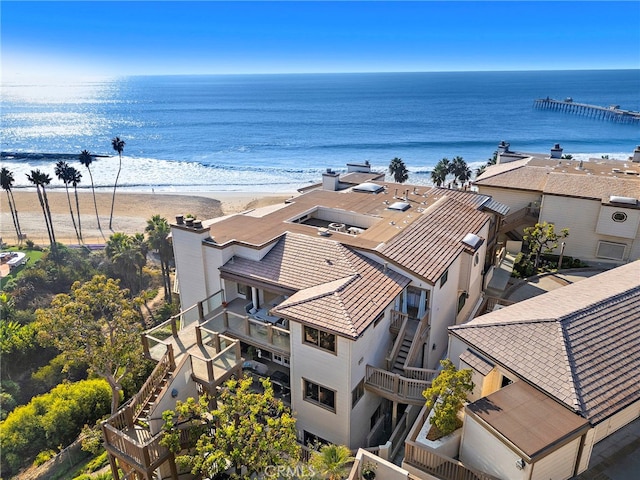 drone / aerial view with a water view and a view of the beach