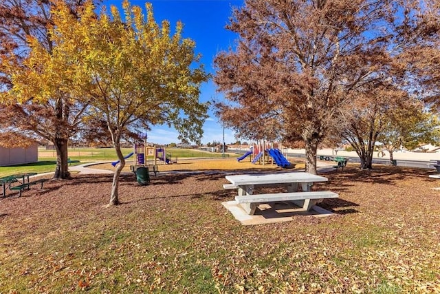 view of community with a playground and a lawn