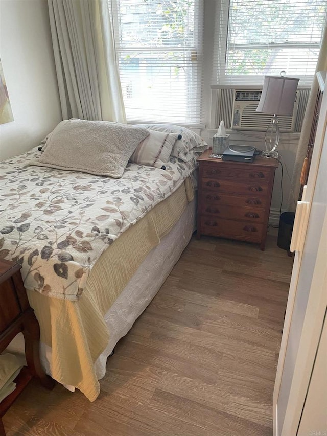 bedroom with wood-type flooring