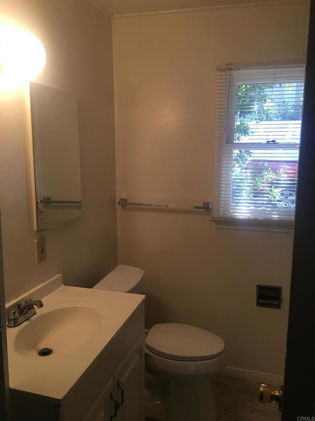 bathroom with vanity and toilet