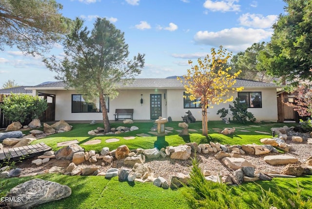 view of front of home with a front lawn