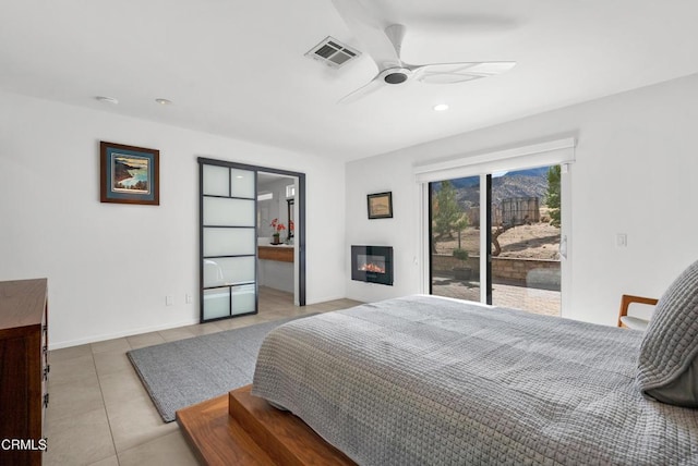 12724 Pallet Mesa Rd, Pearblossom, CA 93553 - bedroom featuring access to outside, light tile patterned floors, a ceiling fan, a glass covered fireplace, and recessed lighting