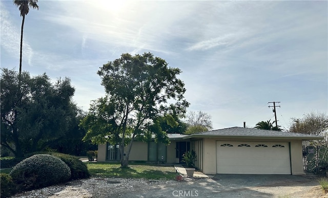 single story home featuring a garage