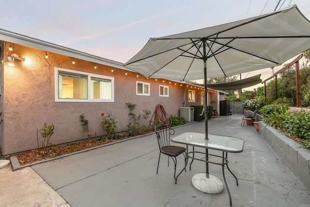 patio terrace at dusk with central AC unit