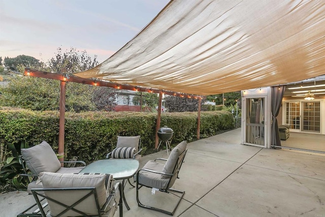 view of patio terrace at dusk