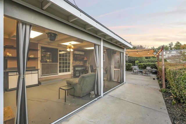 view of patio terrace at dusk