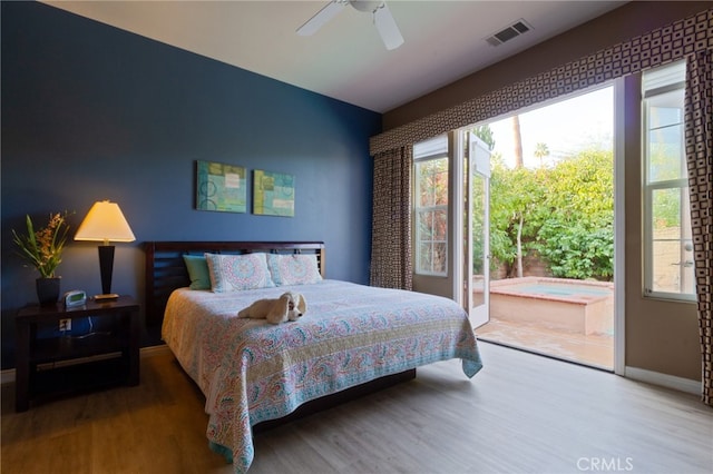 bedroom with access to outside, ceiling fan, and hardwood / wood-style floors