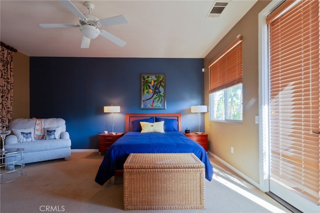 bedroom with carpet floors, access to outside, and ceiling fan