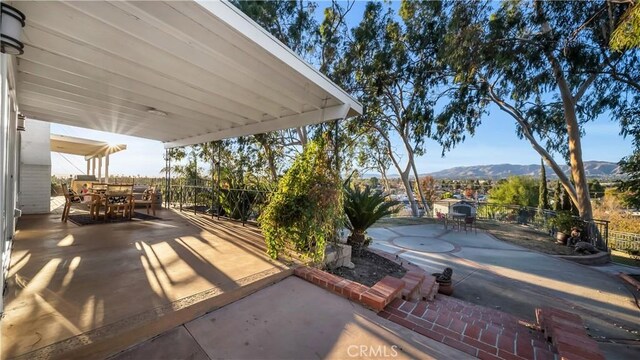 view of patio / terrace with a mountain view