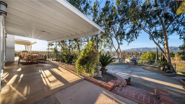 view of patio with a mountain view