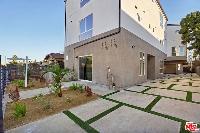 rear view of house featuring a patio area