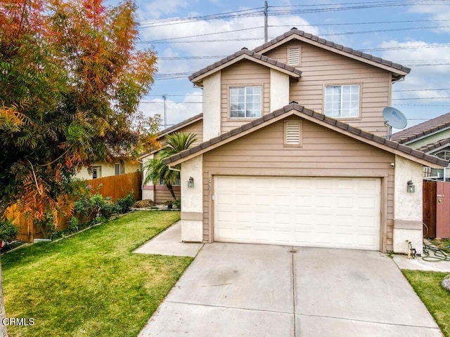 view of front of house with a front yard and a garage