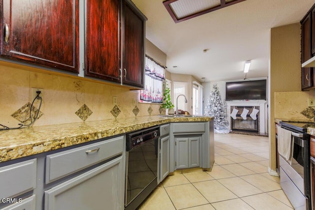 kitchen featuring light stone countertops, stainless steel electric stove, black dishwasher, gray cabinets, and light tile patterned flooring