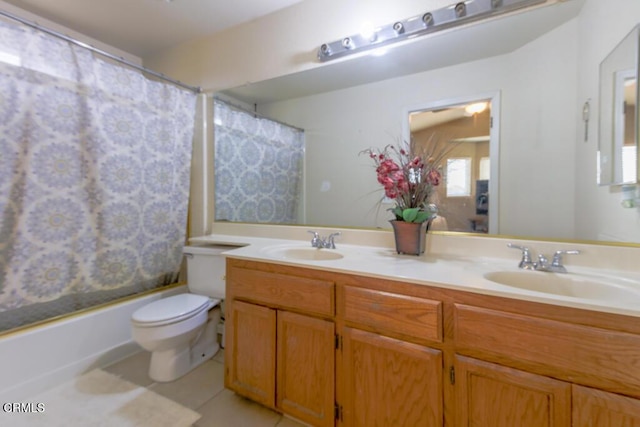 full bathroom featuring tile patterned flooring, vanity, toilet, and shower / bath combo with shower curtain