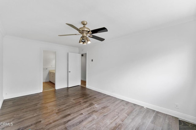 unfurnished bedroom featuring crown molding, ceiling fan, dark hardwood / wood-style flooring, and ensuite bathroom