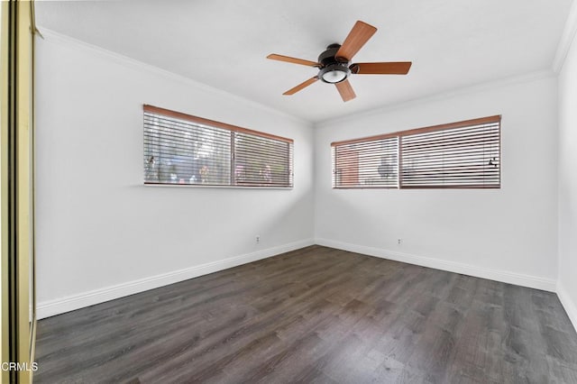 empty room with crown molding, dark hardwood / wood-style flooring, and ceiling fan