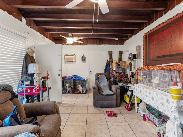 interior space with light tile patterned flooring, ceiling fan, a wall mounted AC, and wood ceiling