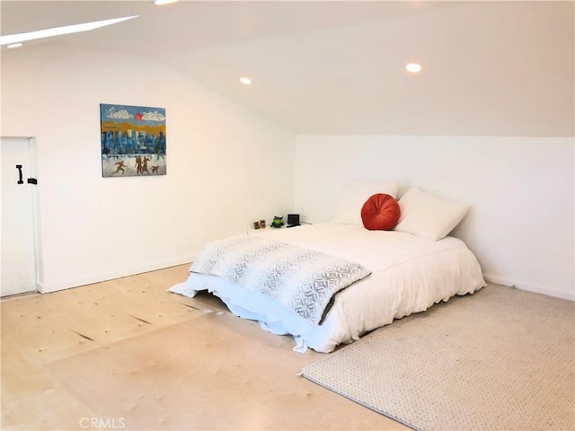 bedroom with carpet flooring and vaulted ceiling