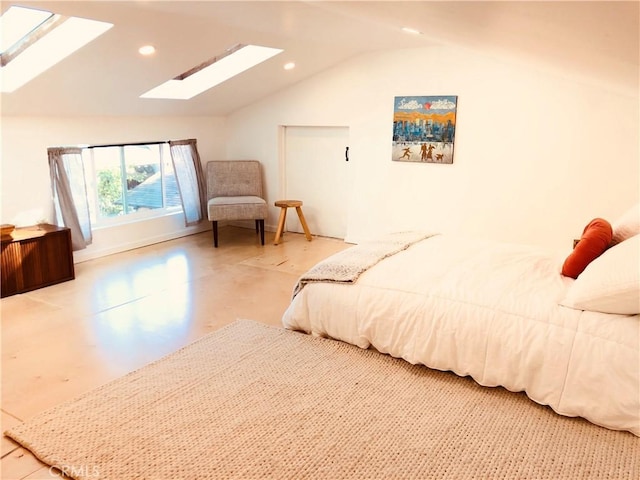 bedroom with vaulted ceiling with skylight