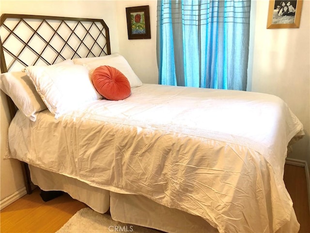 bedroom featuring hardwood / wood-style flooring