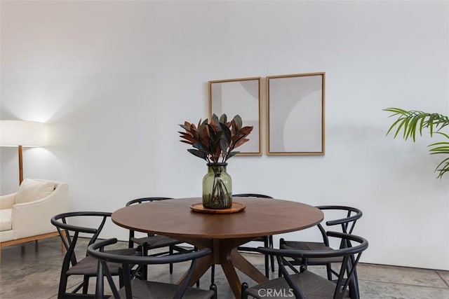 dining room featuring concrete floors