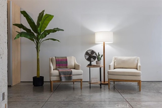 living area with concrete flooring