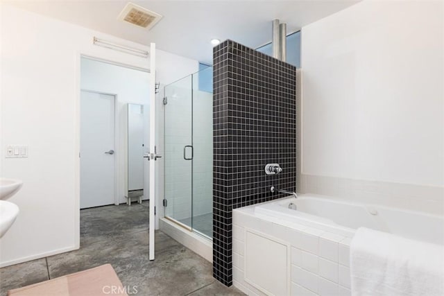 bathroom with separate shower and tub