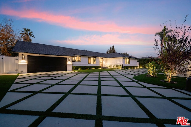 single story home featuring a garage