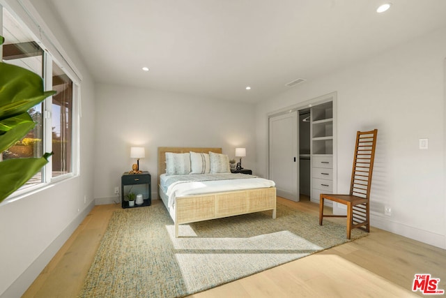 bedroom with light hardwood / wood-style floors