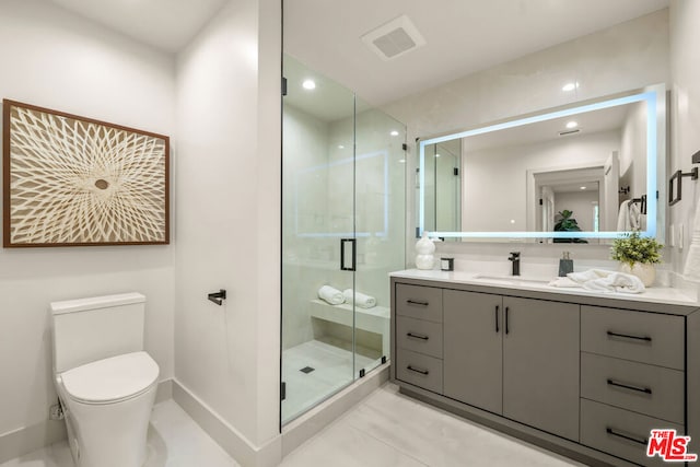 bathroom featuring vanity, toilet, and walk in shower