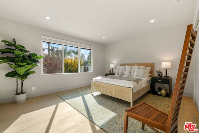 bedroom featuring light hardwood / wood-style floors