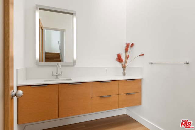 bathroom featuring vanity and hardwood / wood-style flooring